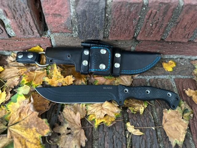 Custom, handmade leather dangler sheath for busse combat knife.