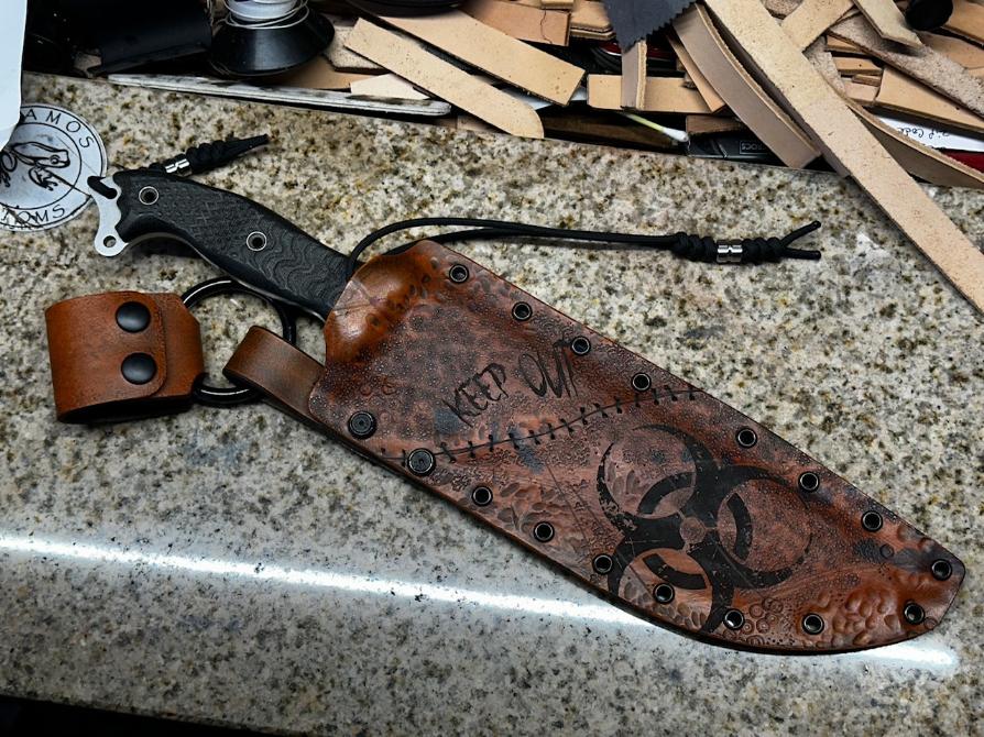 Busse anorexic custom zombie sheath. Leather over kydex hybrid. 